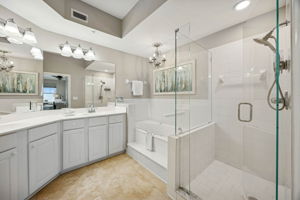 The ensuite bath is bright and generously sized ...