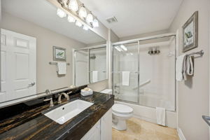 Granite counters continue into the guest bath which serves this bedroom and the main living areas with ease.