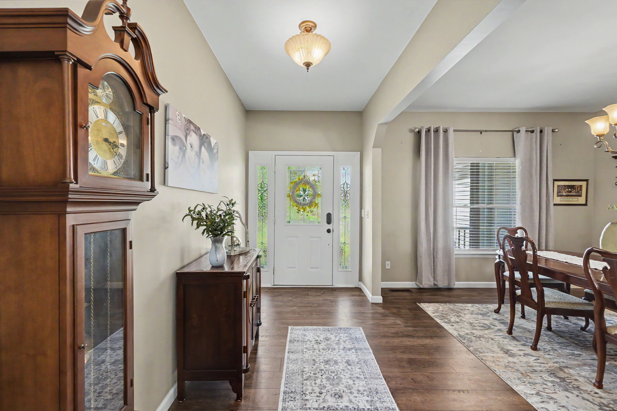 Entry foyer showcased the laminate flooring and formal dining area.