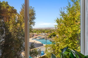 Loft view of next door's pool