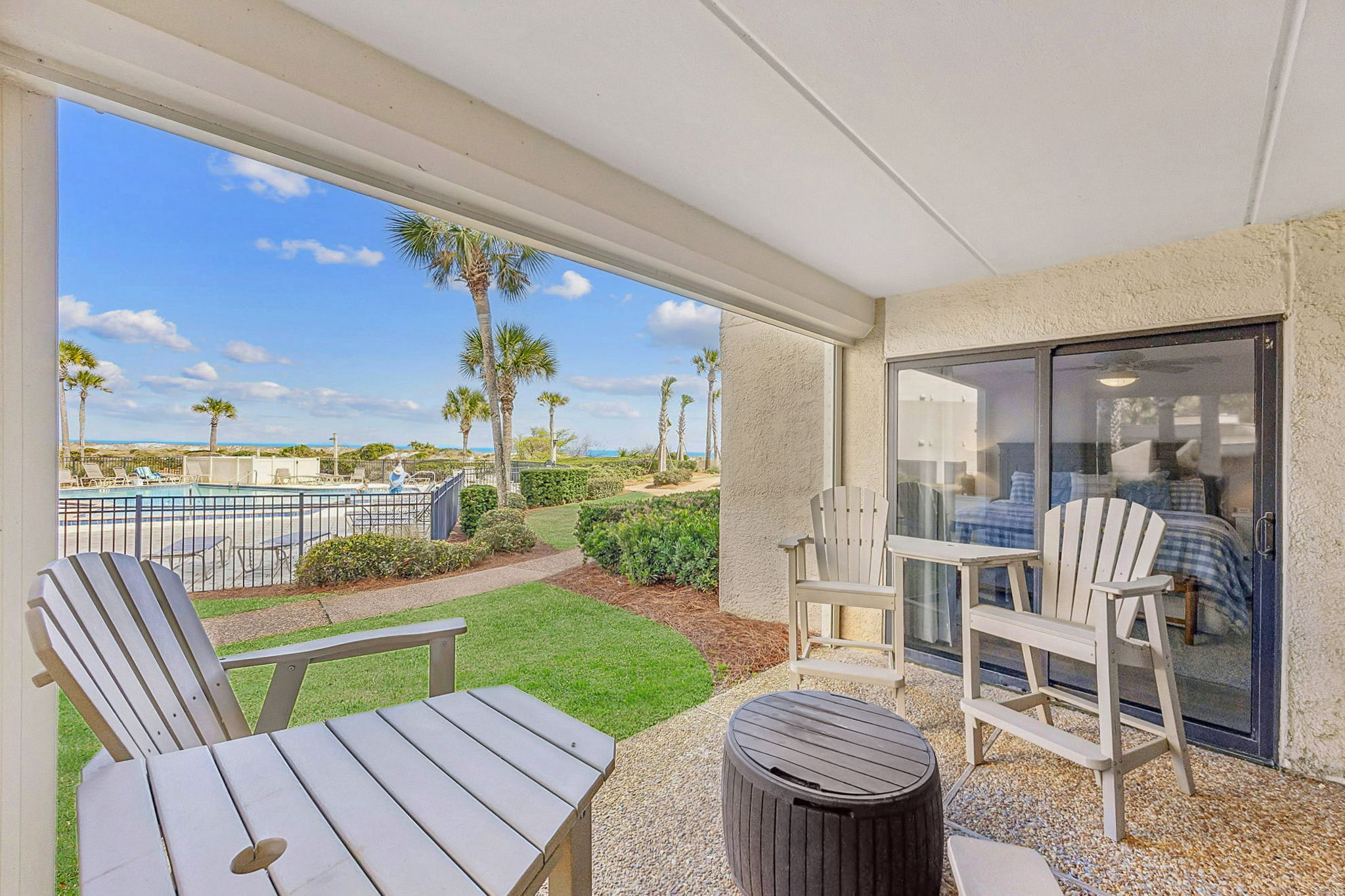 Hurricane shutters enclose the patio’s two open sides ...