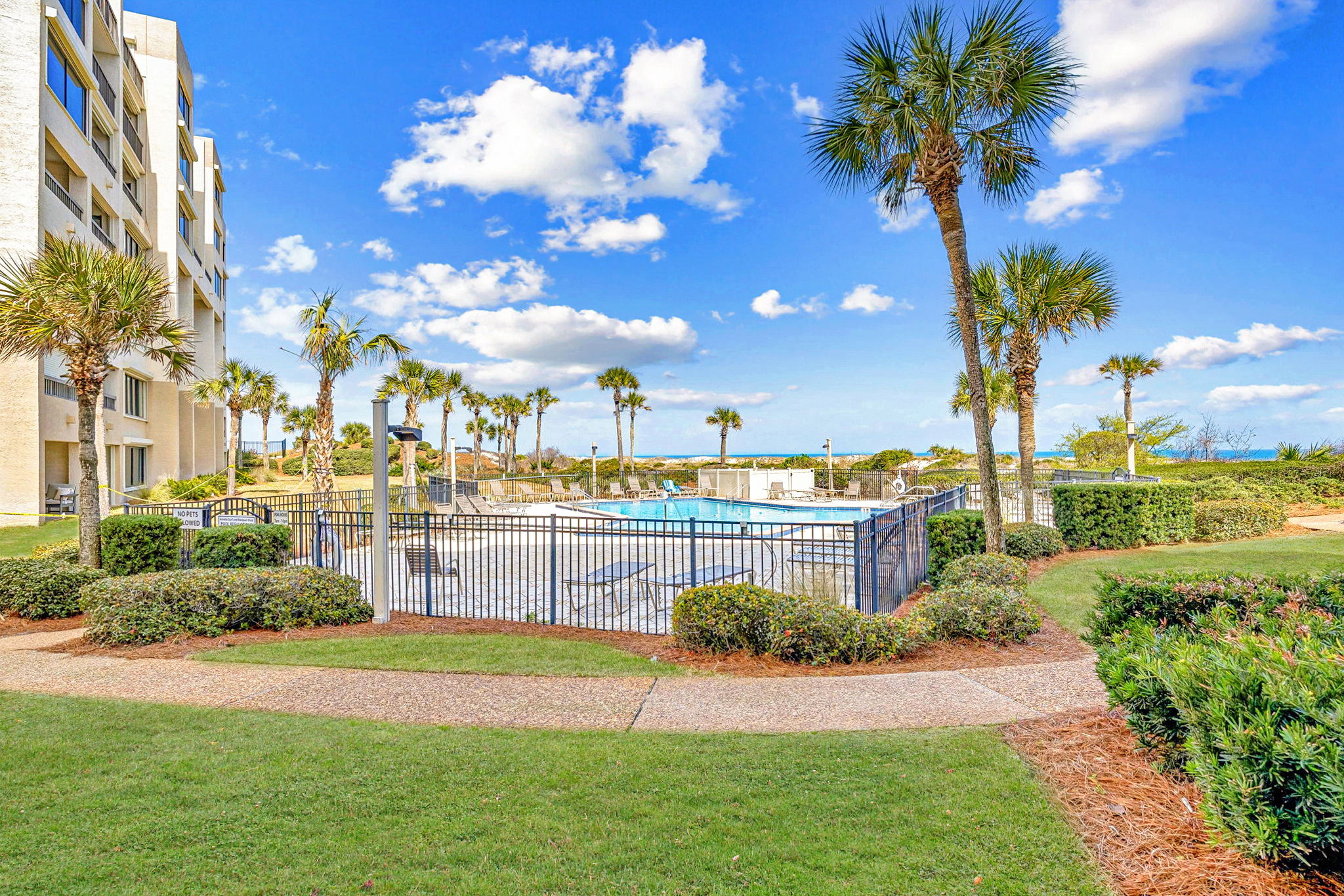 And just beyond, the landscaped grounds, pool, and oceanfront setting remain part of the everyday view