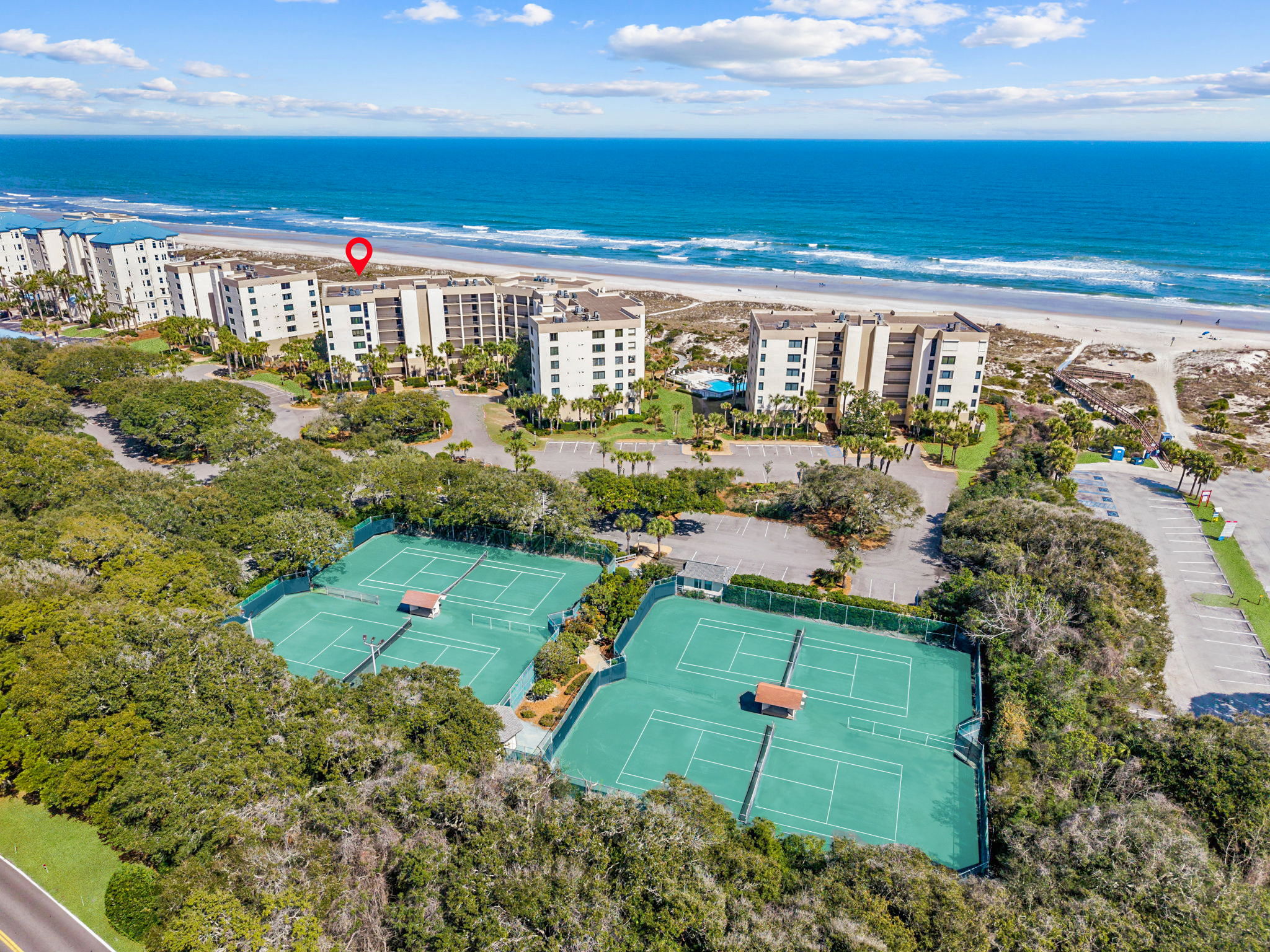 From above, the layout is especially compelling: oceanfront buildings, resort amenities, and on-site racquet courts all in one setting ...