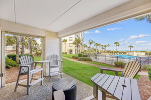 The covered patio extends the living space with a private, easy spot to relax outdoors ...