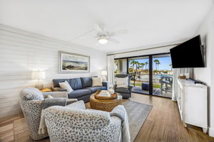 Even indoors, the connection to the patio, pool, and ocean remains part of the experience