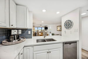 A generous pass-through and breakfast bar make the space feel open, easy, and social ...