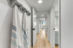 The bedrooms are tucked away for privacy, with the same clean finishes carried throughout