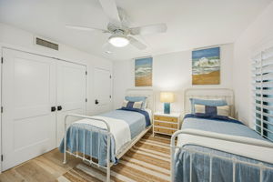 From the opposite angle, the room feels both airy and functional, with space to relax and settle in ...