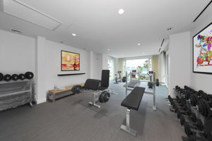 Indoor exercise room with partial ocean view