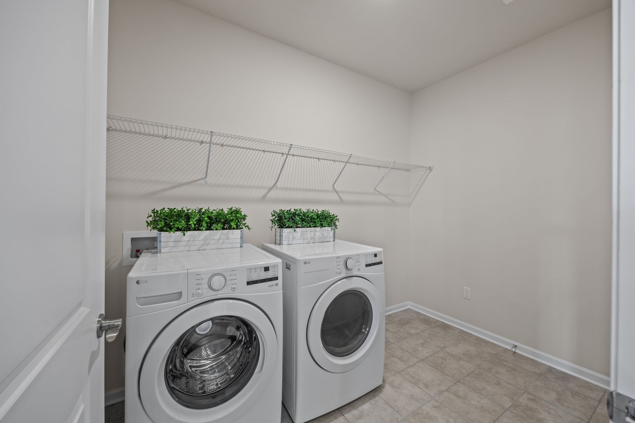 The extra heartbeat of activity right off kitchen.  Room for extra organization that makes life easy without clutter.  Connects with voluminous garage.