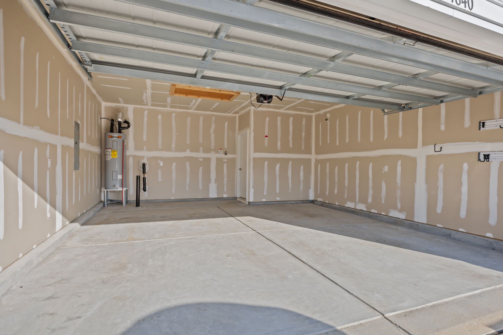 Insulated and drywalled, extra large garage!  PLUS BONUS storage room with pull down stairs!