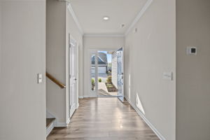 Hallway with 2 large closets and arched offset entry to Office/Bedroom#1 and Full Bath. Very private!