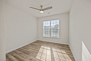 Office/Bedroom #1 w/large closet is filled with natural light.  Upgraded contemporary ceiling fans throughout home.  Full bath just off this arched offset entryway.