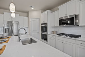 UPGRADED Frigidaire Gallery appliances include double wall oven and fully programmable state of the art microwave, dishwasher, built-in range.