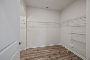 PRIMARY CLOSET - Oh my goodness! Enjoy LVP flooring and loads of space! Wonderful!