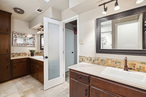 Dual Sinks of Primary Bathroom of Larger Unit