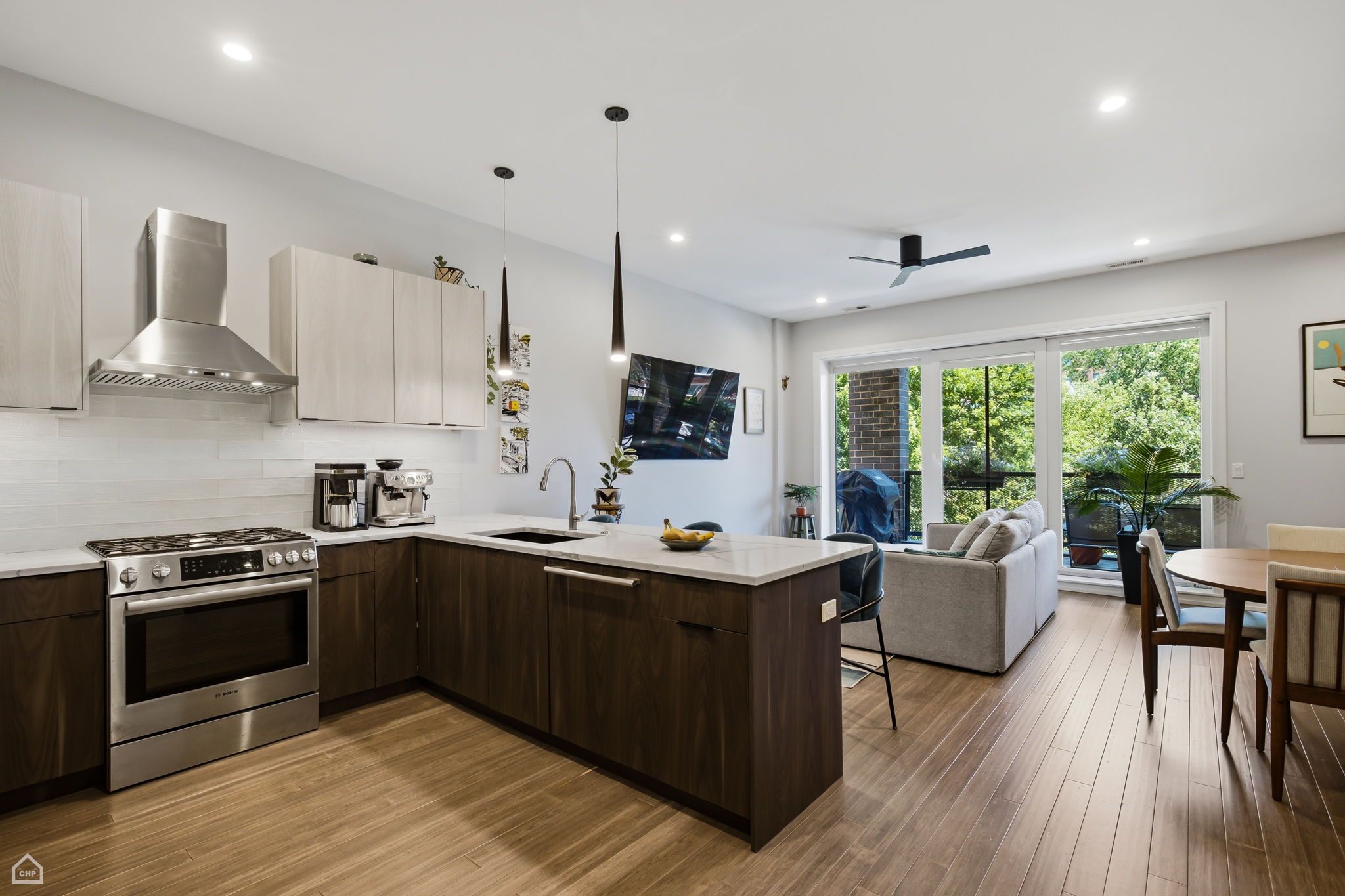 Under cabinet lighting complimented by quartz countertop and backsplash
