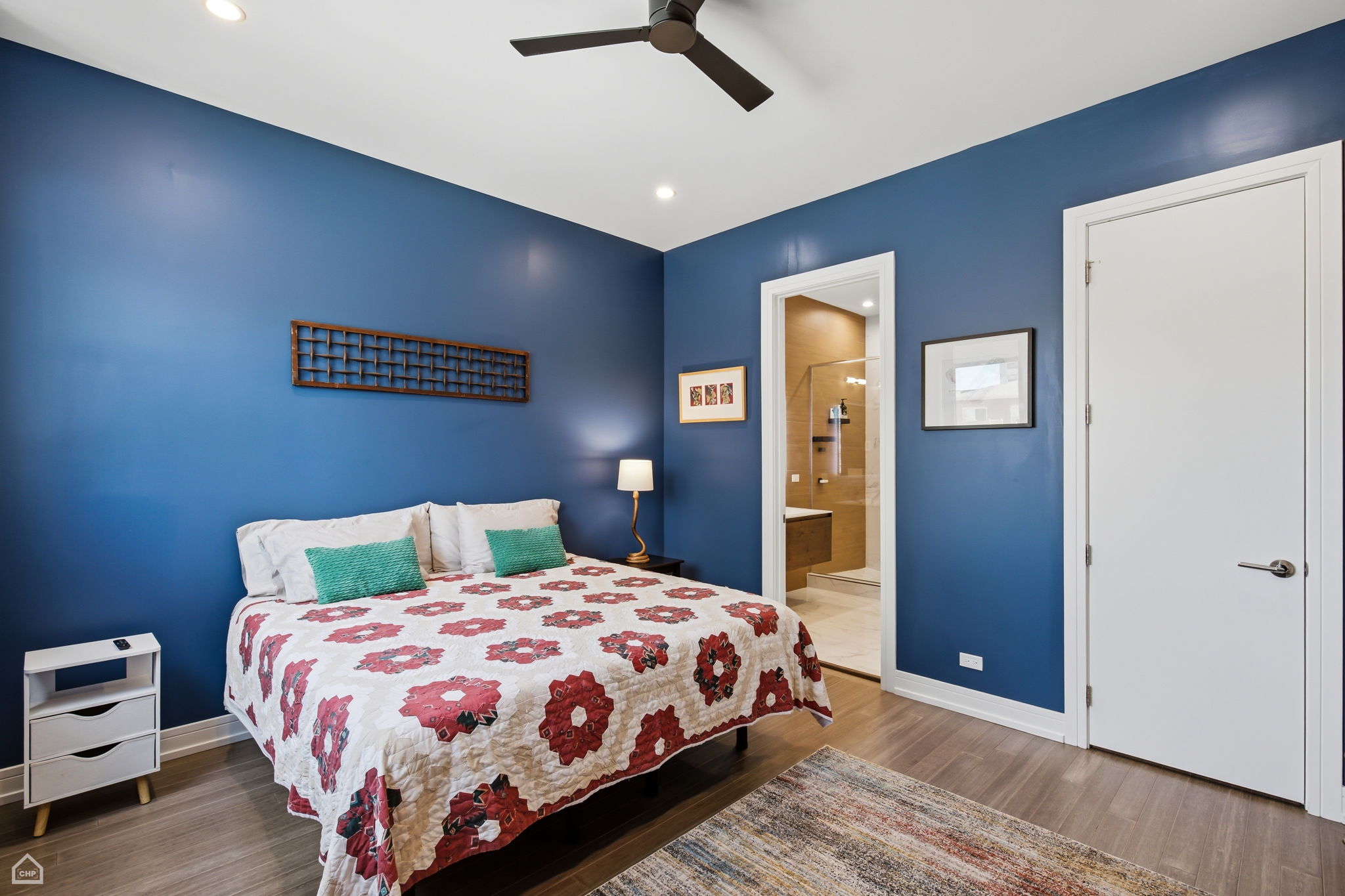 Large, tranquil primary bedroom en-suite with walk in closet