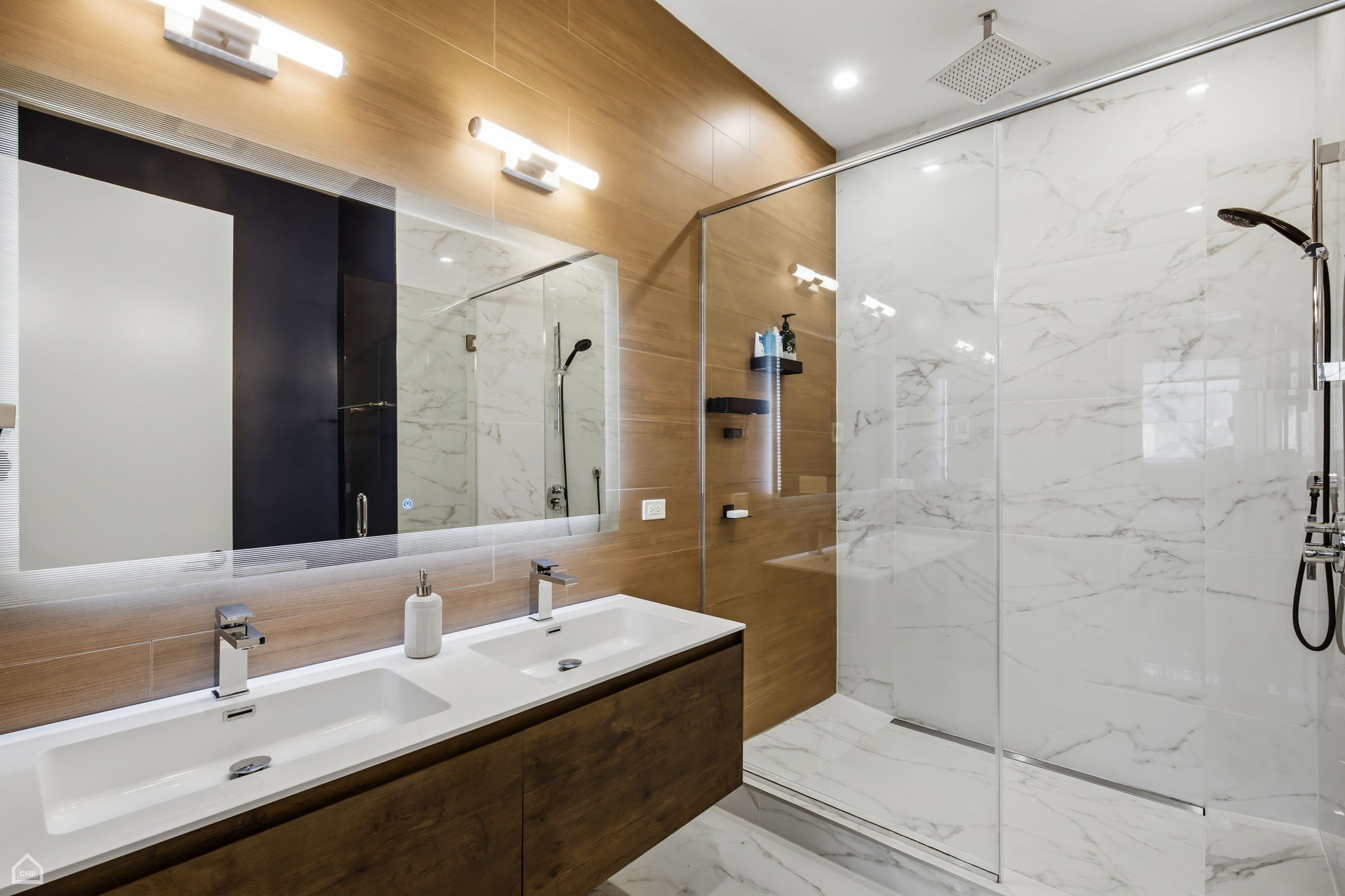 Primary bath features luxury shower, heated porcelain tile floor and linear drains