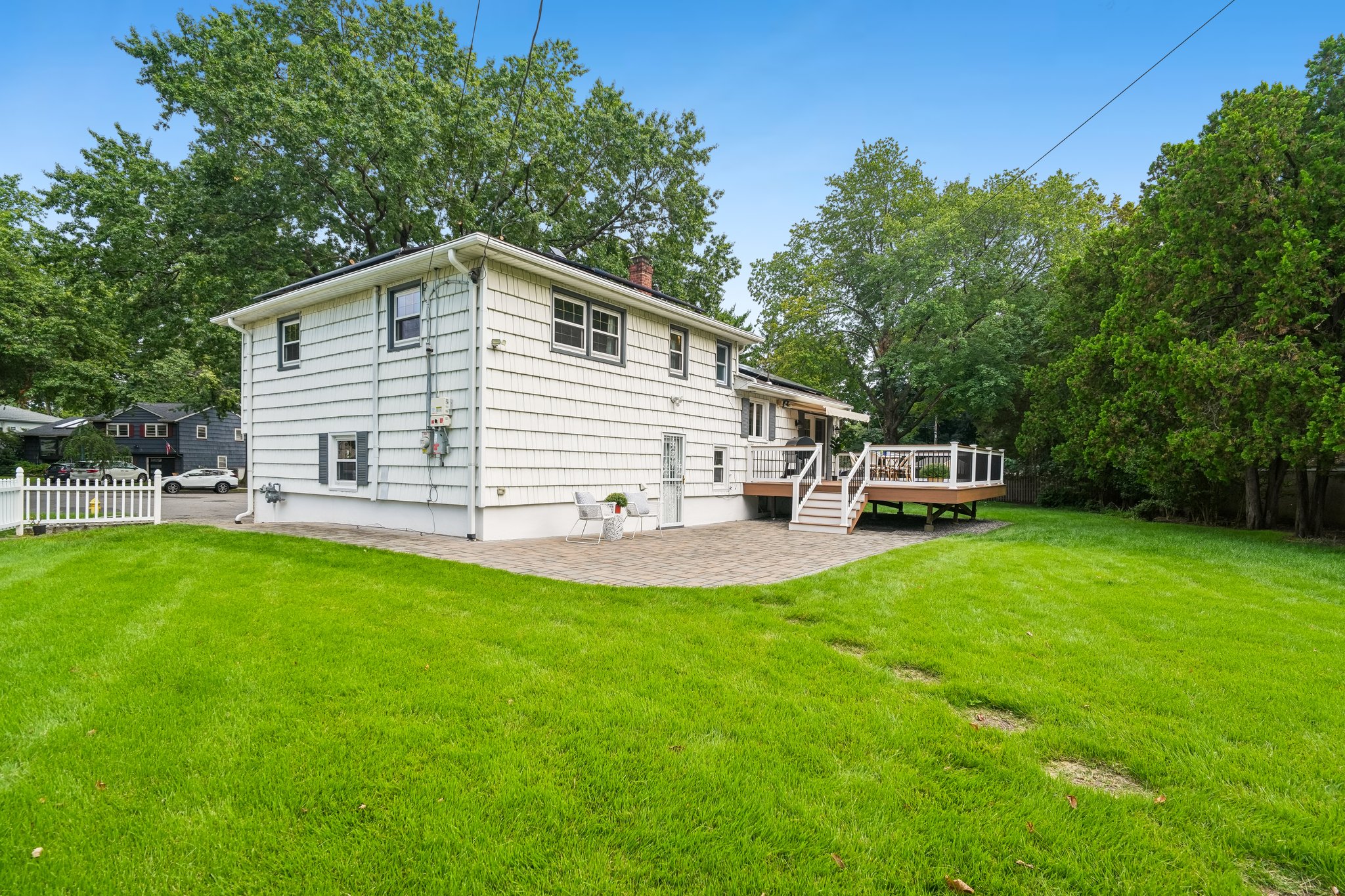 Side view with deck and patio