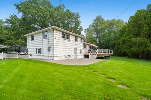 Side view with deck and patio