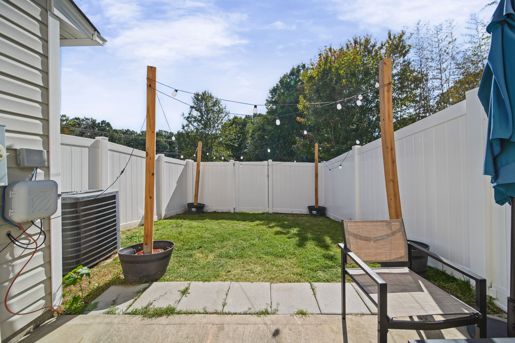 Fenced Back Yard with Lights.