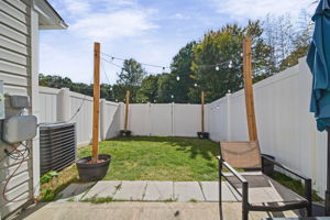 Fenced Back Yard with Lights.
