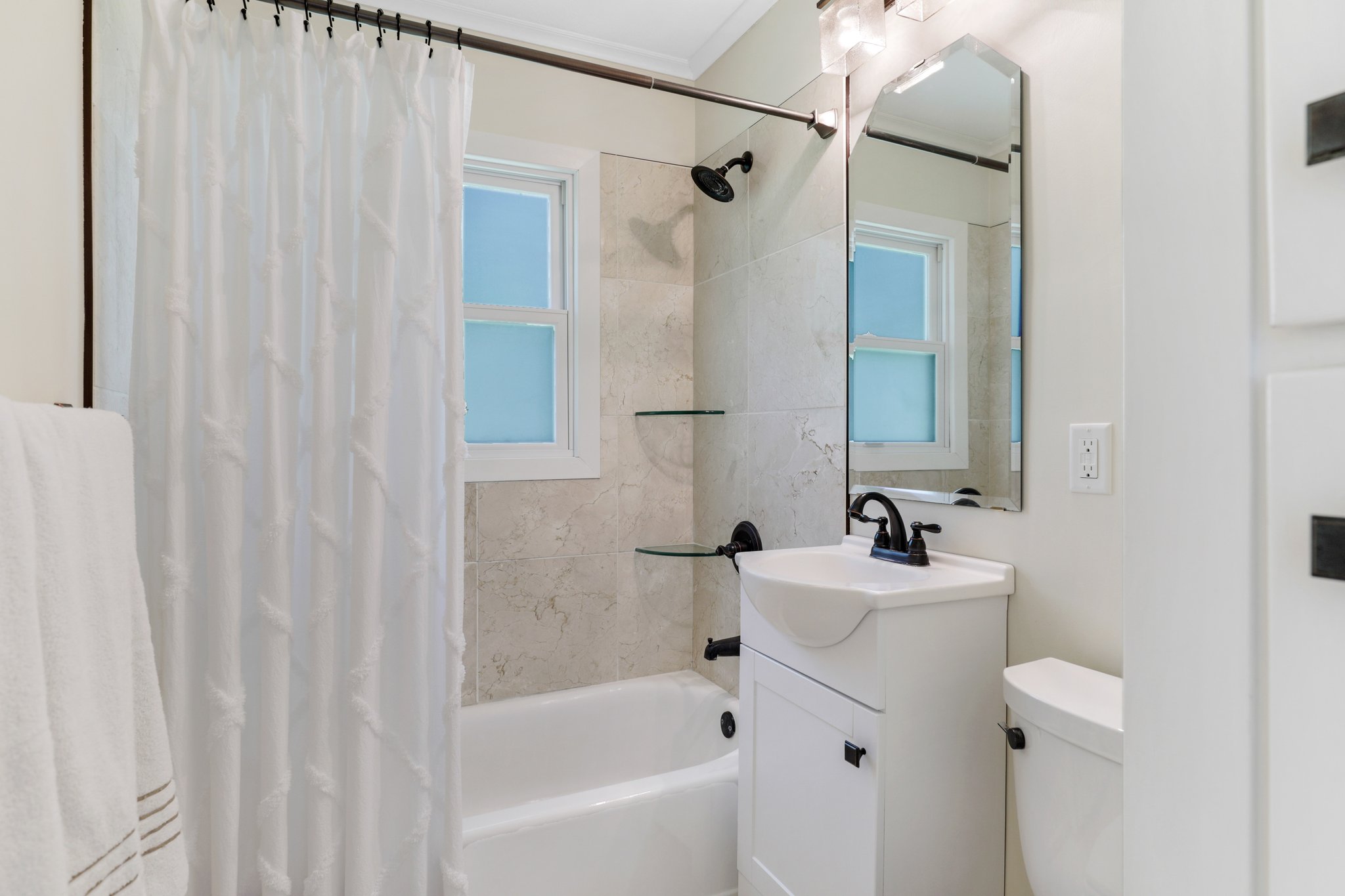 Updated bath - New tile, tub, vanity