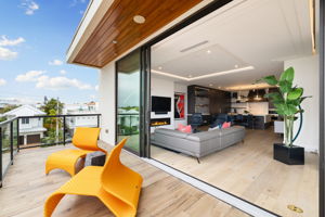 Glass Doors Open to Balcony & Great Room