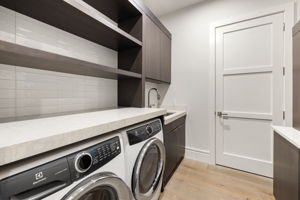 Spacious Laundry with Sink & Cabinetry