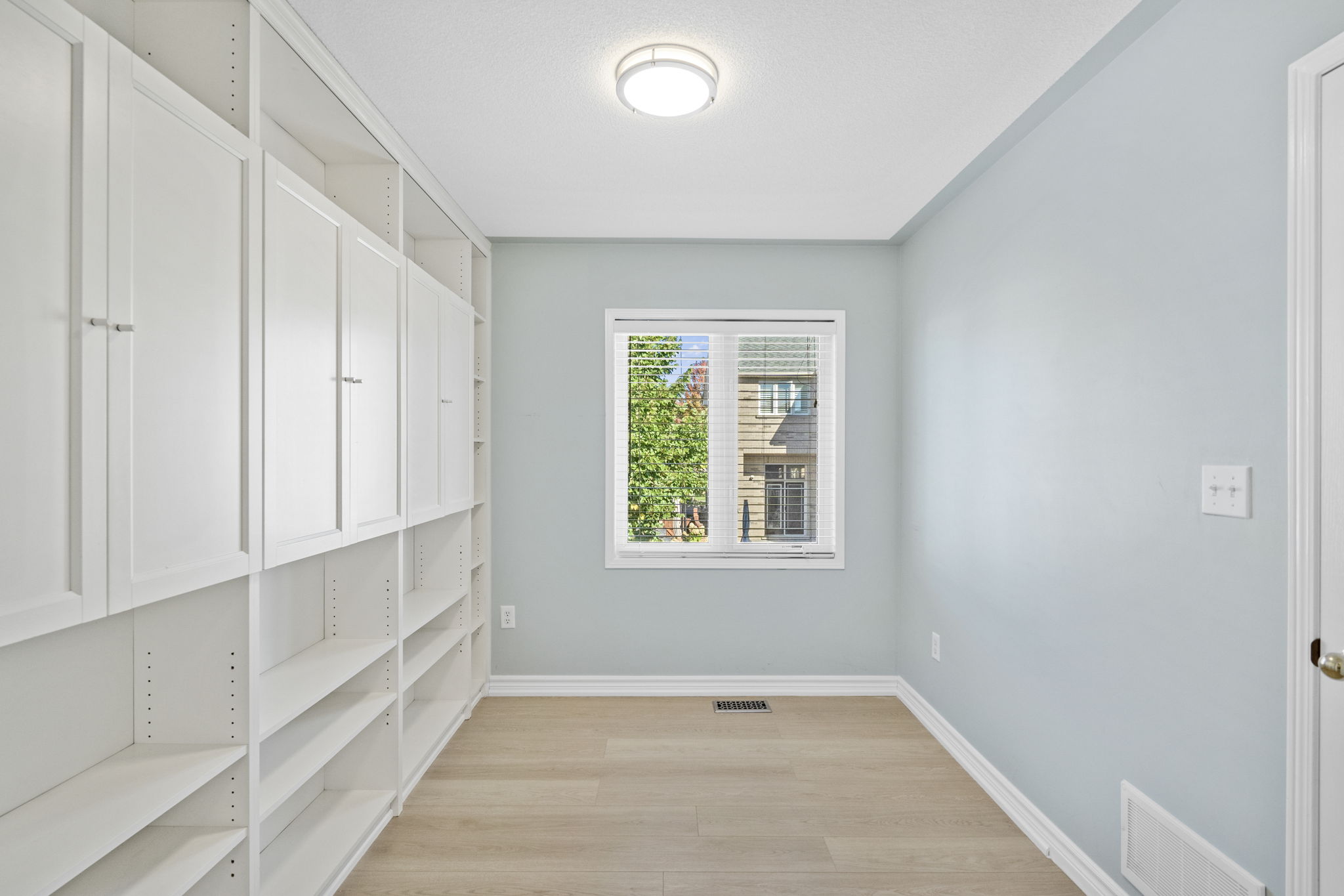 Bedroom with Built in Shelving + Closet