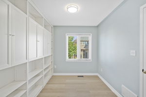 Bedroom with Built in Shelving + Closet