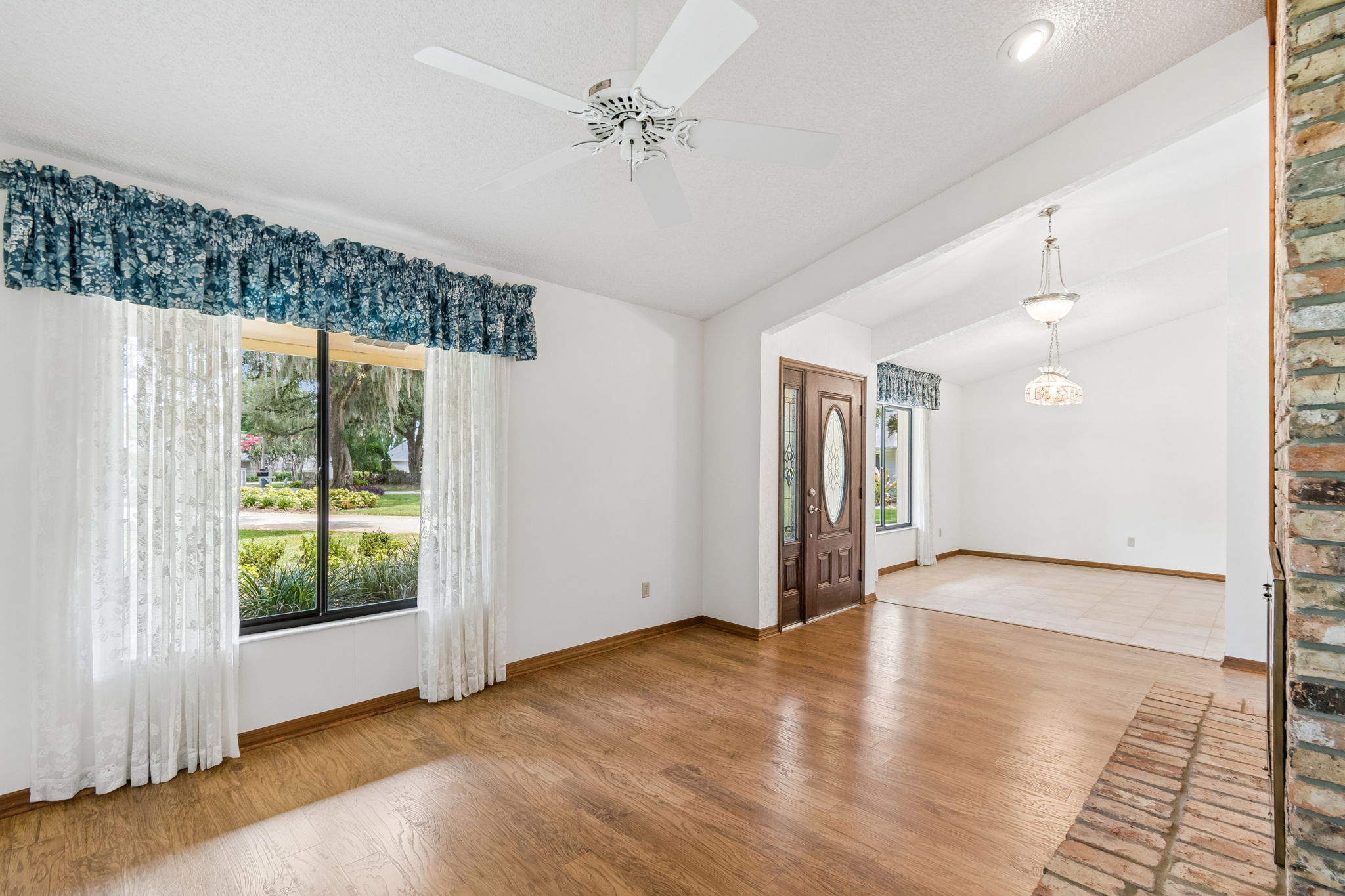 Formal living room features vaulted ceiling