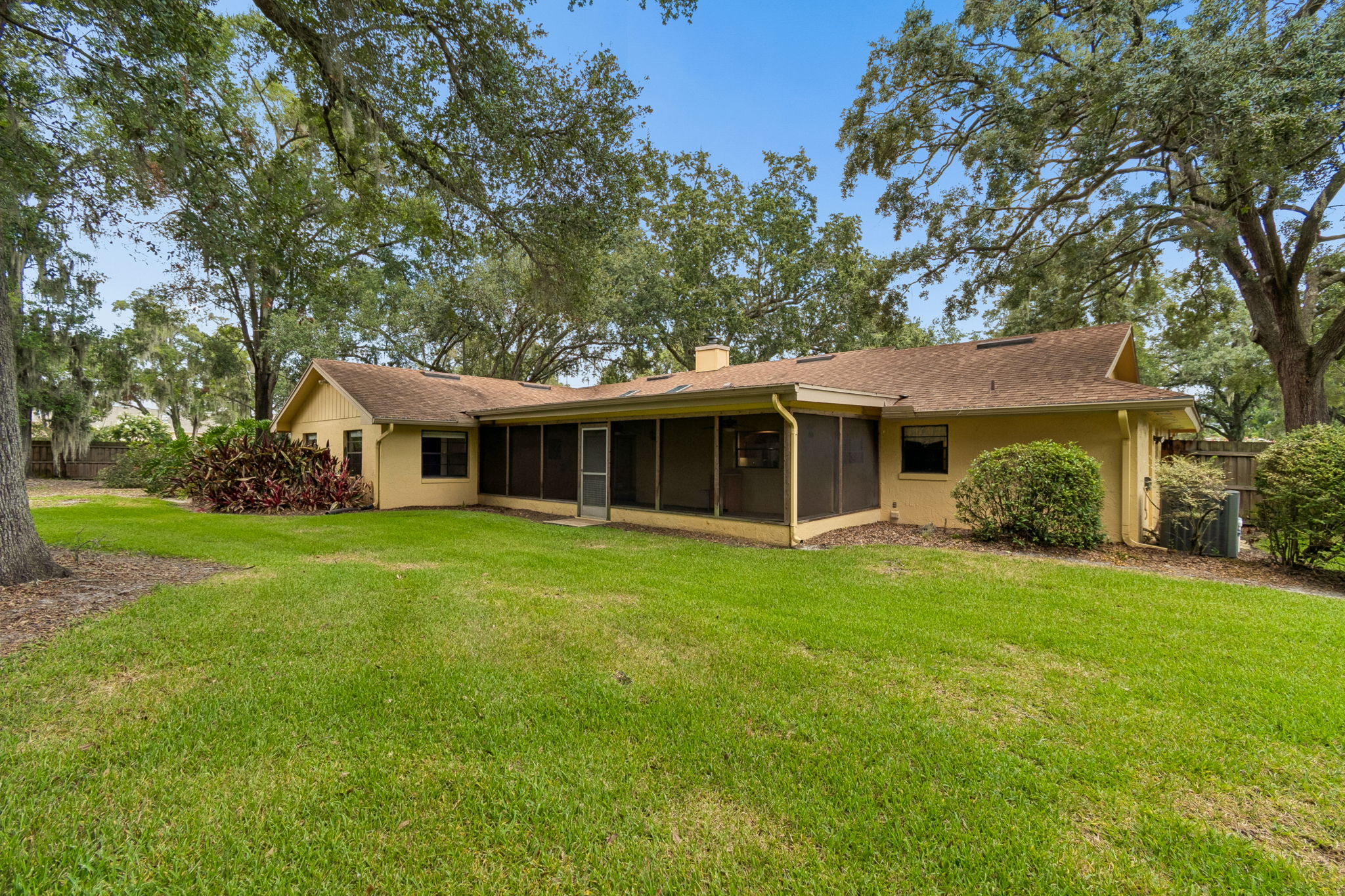 Large screened patio opens to backyard
