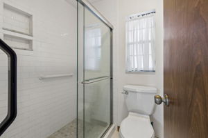 Tiled shower in primary bathroom