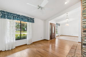 Formal living room features vaulted ceiling