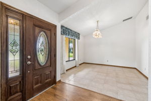 Gorgeous wood entry door with leaded glass
