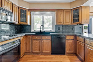 Oak cabinetry and hardwood flooring