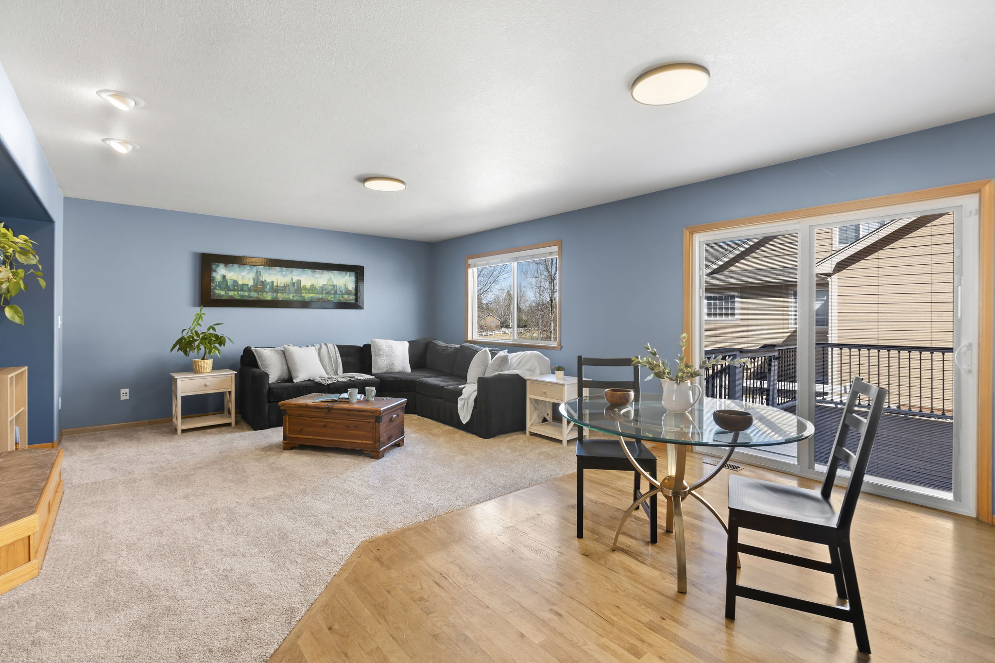 Sliding door leads to back decks and backyard. This room looks out to the green space as well