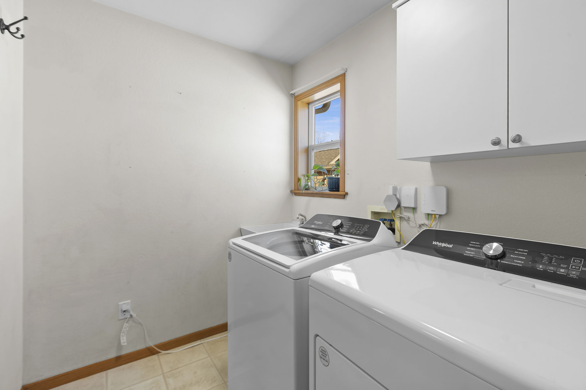 Main level laundry area off the garage and the kitchen - great area to use as a mud room, too