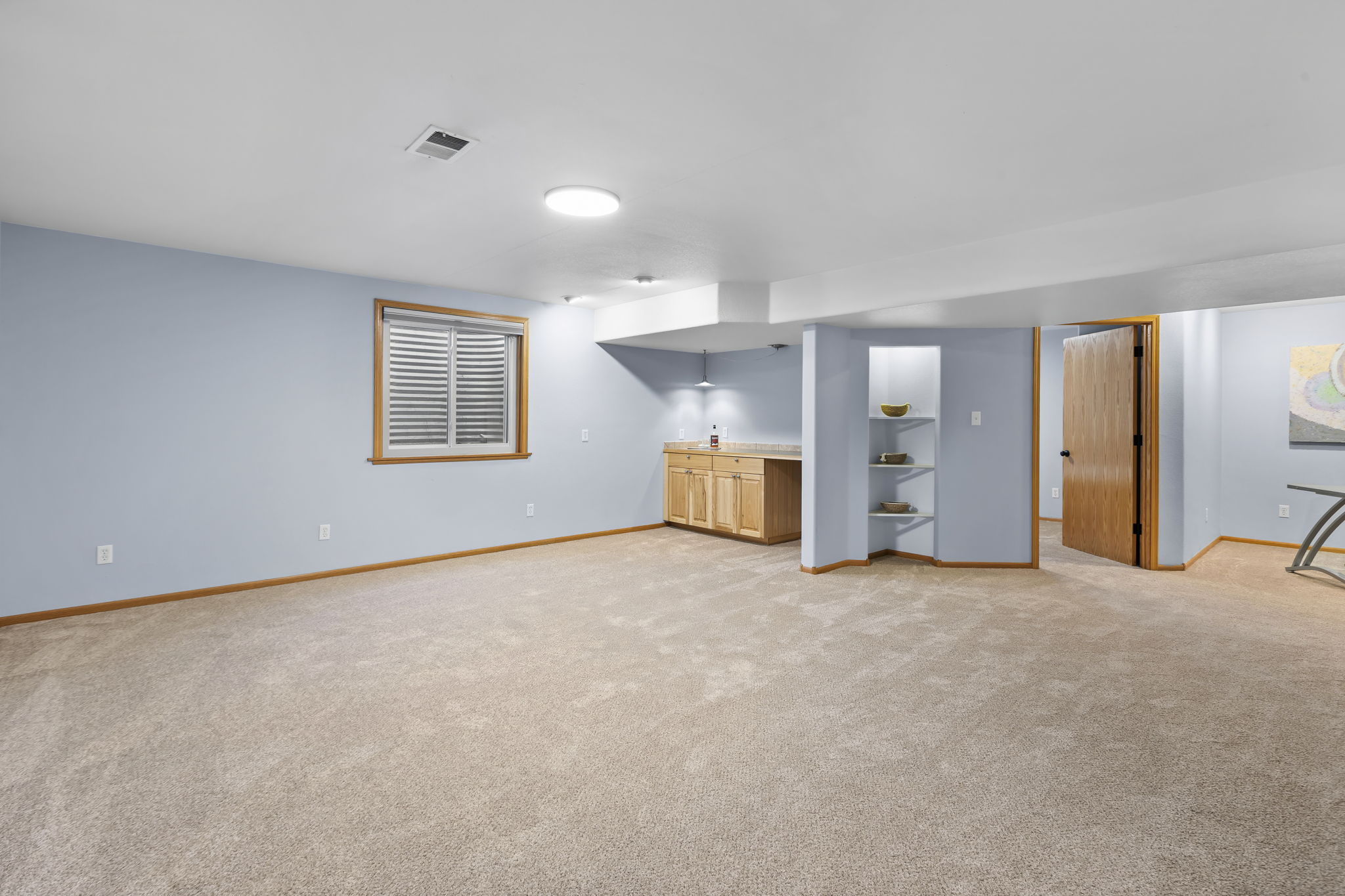 Rec room with built in bar. Brand new carpet