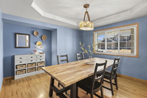 Just off the entry and with proximity to the kitchen, this formal dining room provides space to gather as well as mountain views