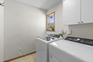 Main level laundry area off the garage and the kitchen - great area to use as a mud room, too