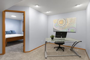 Multi-use space in the basement off outside the two bedrooms