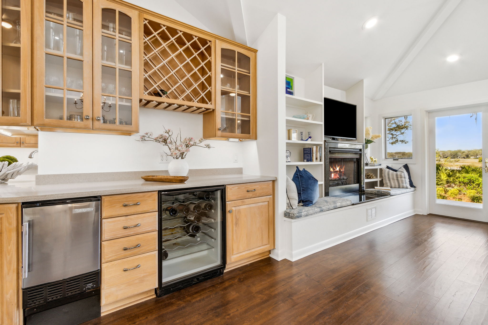 An extended bar area elevates wine storage and cocktail mixing for effortless entertaining.