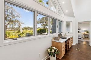 Maximizing functionality, nestled by the windows is a picturesque desk area.