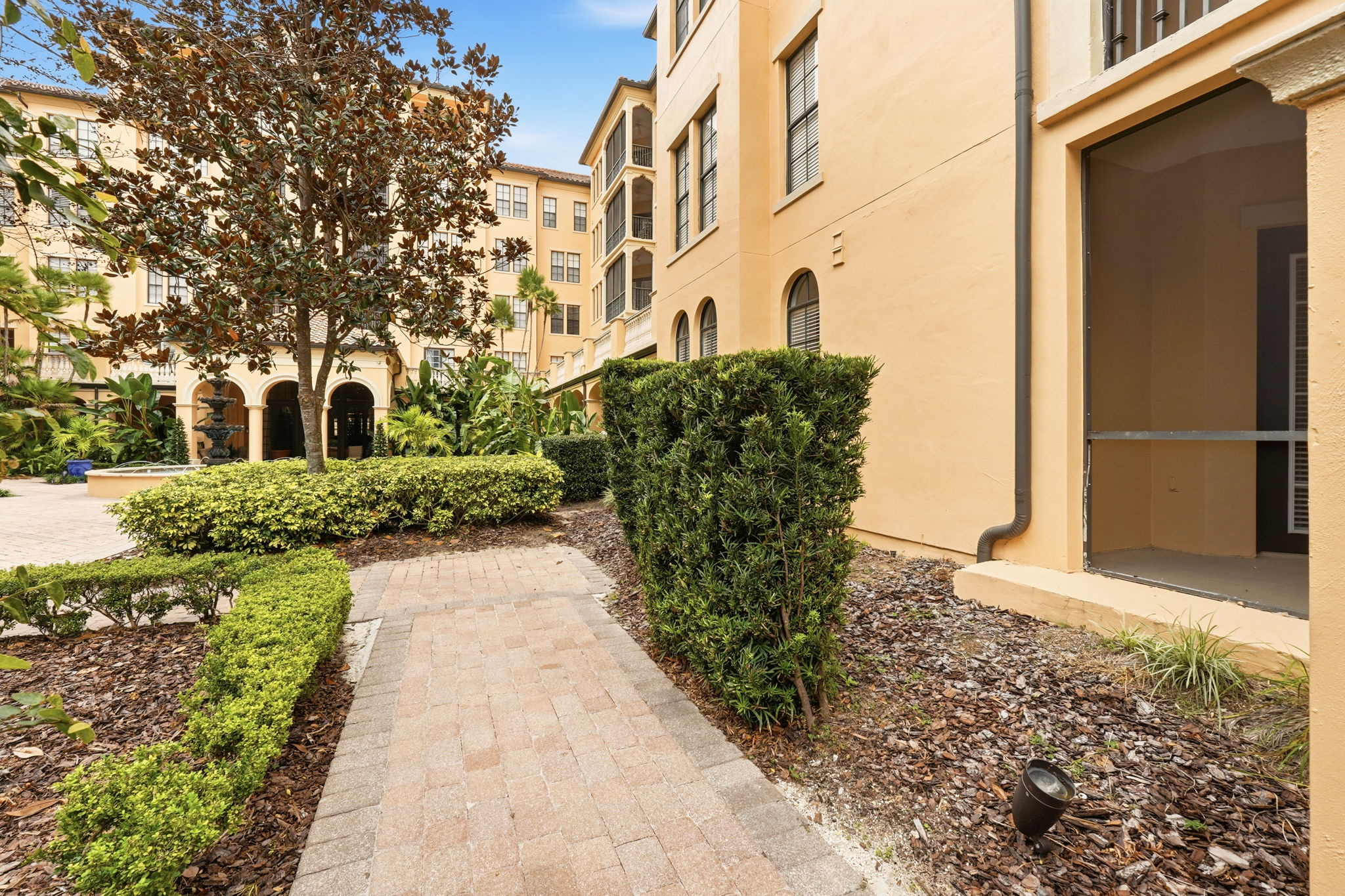 Entry to Plush Courtyard