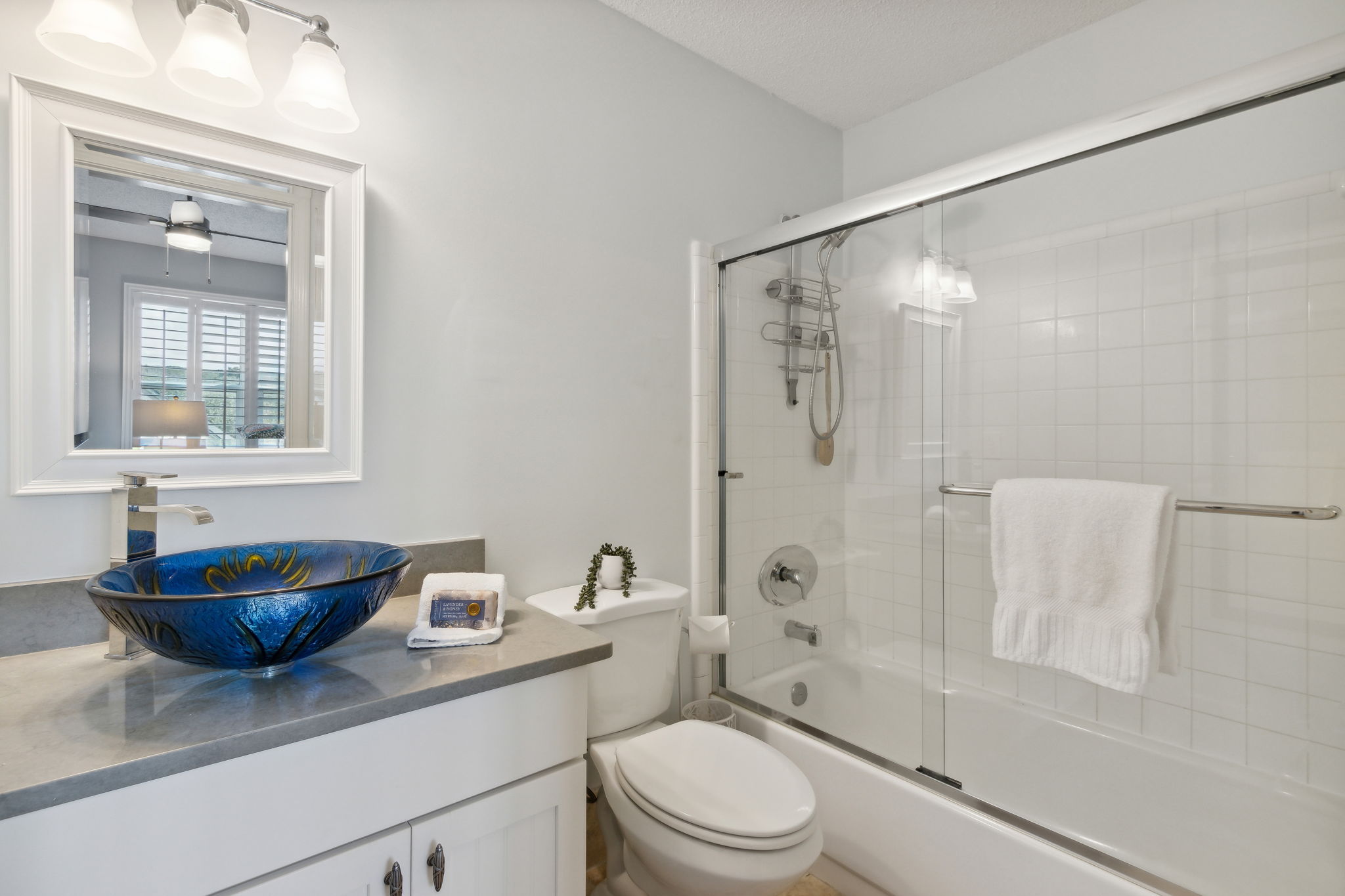 The recently renovated guest bath is ensuite, with a shower/tub combo.