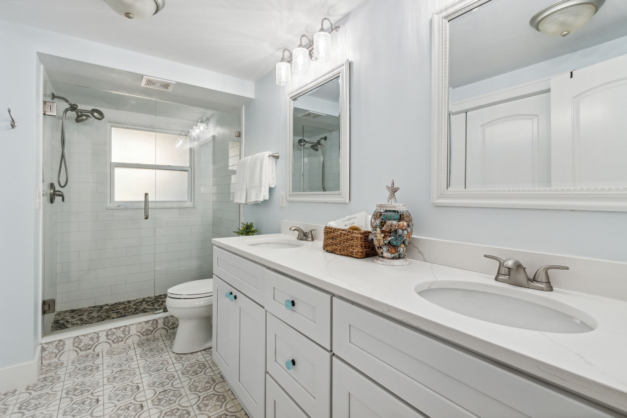 ... and floor-to-ceiling tiled, walk-in shower.