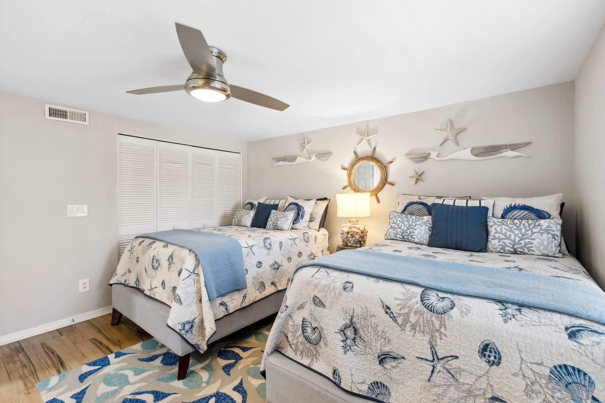 Both bedrooms boast new wood-grain tile floors that beautifully complement the flooring in the common living area.